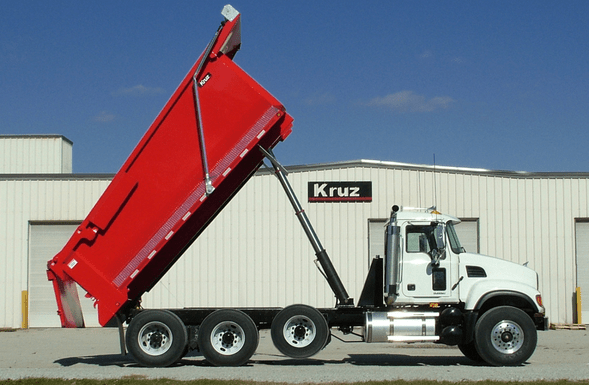 steel dump bodies by Kruz Inc.; white truck cab with red steel body dump trailer